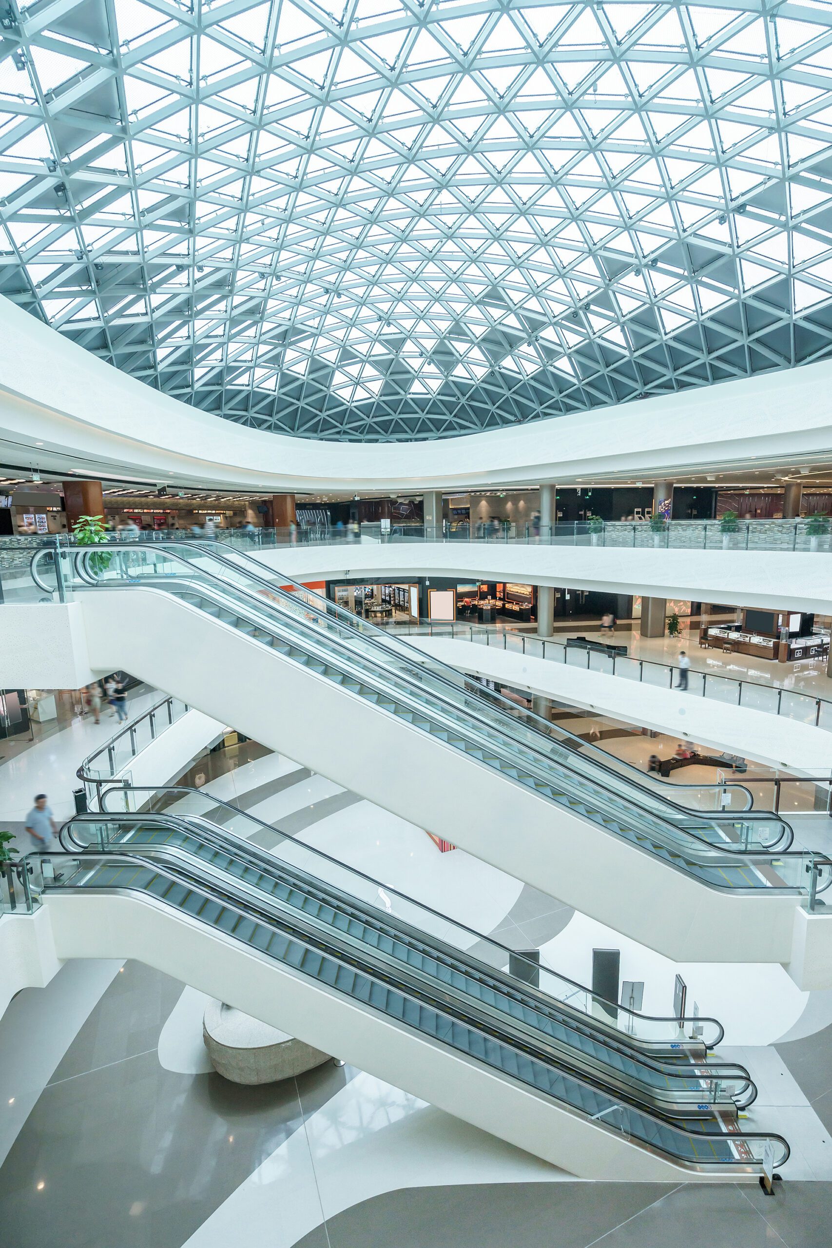 abstract ceiling and escalator in hall of shopping mall